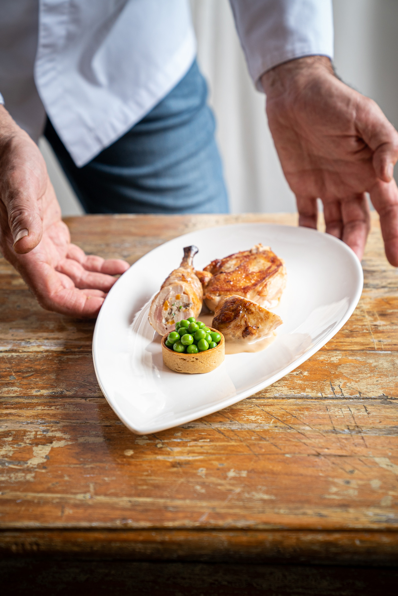 meal of chicken and peas by chef Didier Leroy photographed by Bruno Florin for Van Houtte 100th anniversary