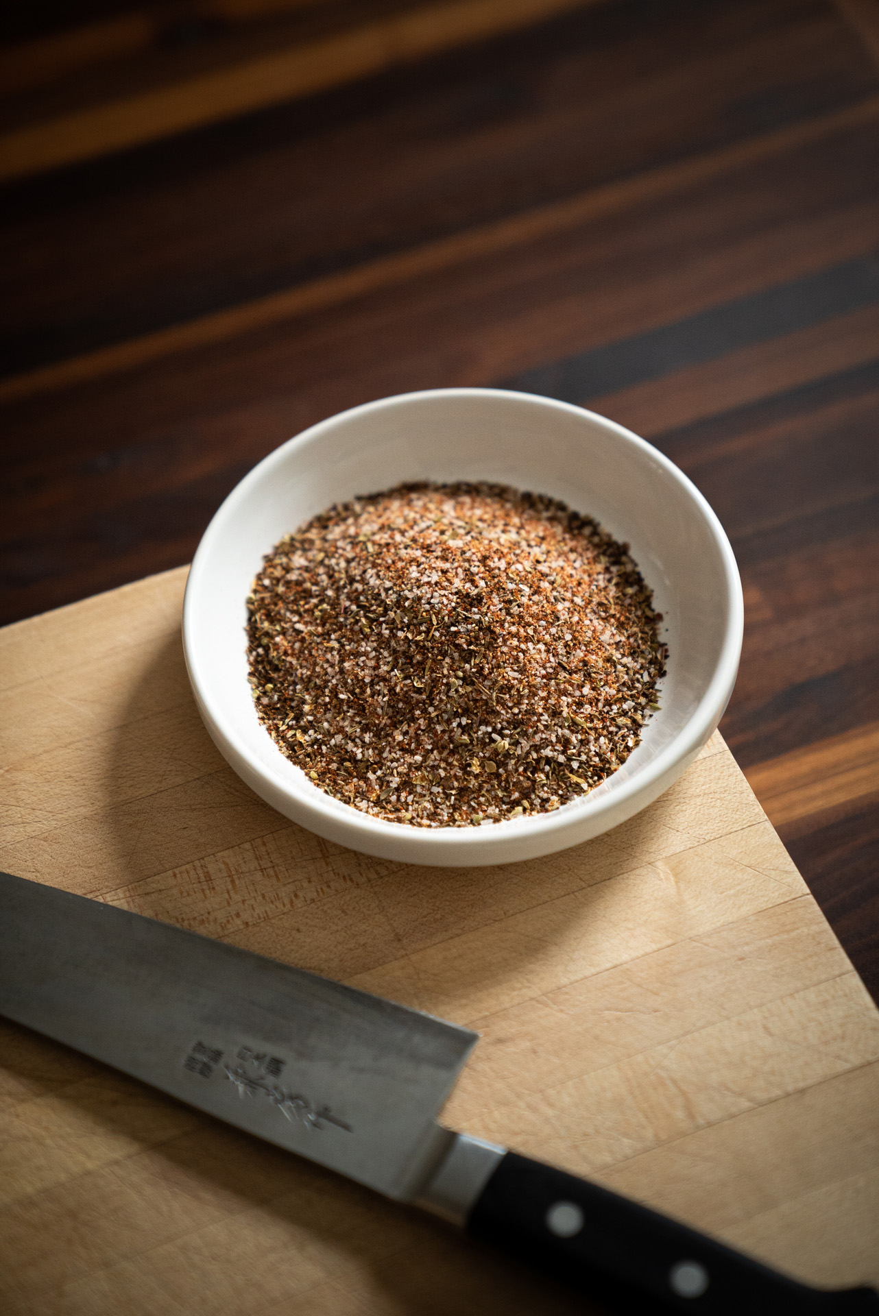 chef Michael Allemeier bowl of meat spices next to chef knife by Bruno Florin for Van Houtte 100th anniversary