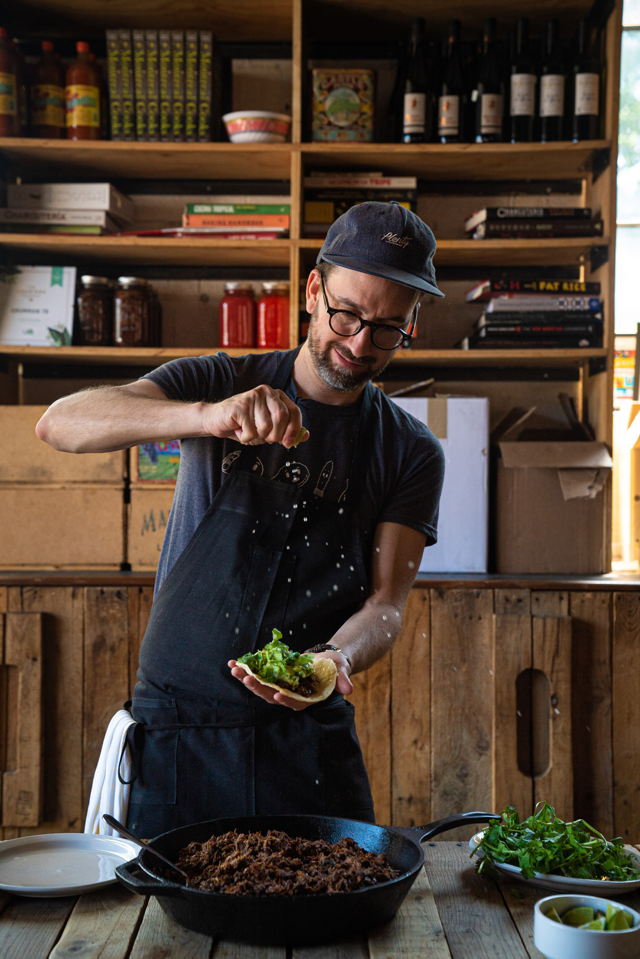 chef Sebastian Harrisson-Cloutier sprinkling salt on his meat taco by Bruno Florin for Van Houtte 100th anniversary