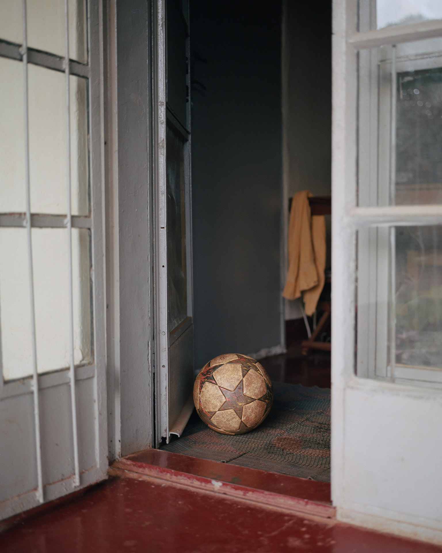 beaten soccer ball at the entrance of a house by Alexi Hobbs in Uganda for Football for good with Sportsnet