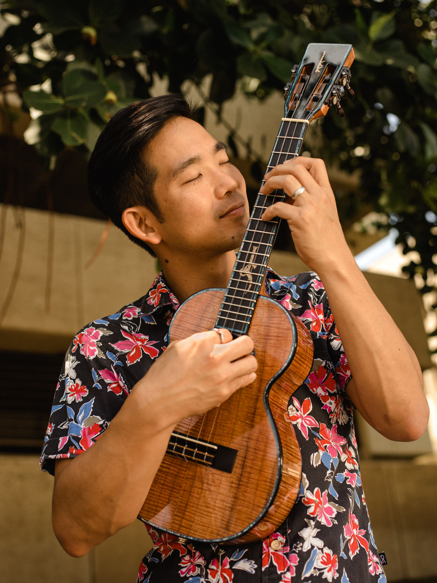 native hawaiian male playing ukulele by Alexi Hobbs in Hawaii for en Route