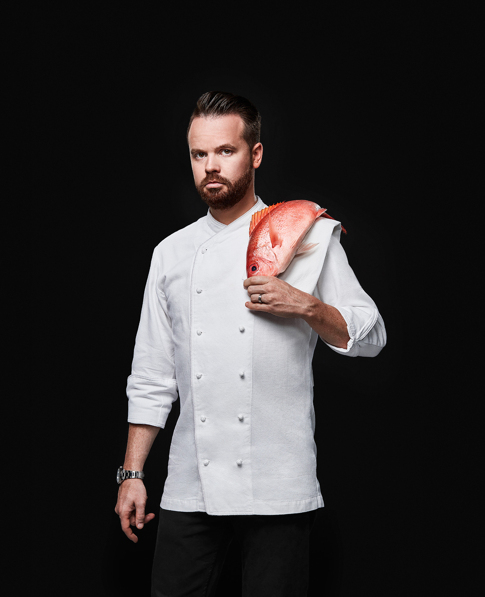 portrait of chief Olivier Vigneault short-haired male with red fish on his shoulder by Jocelyn Michel for the Cathcart