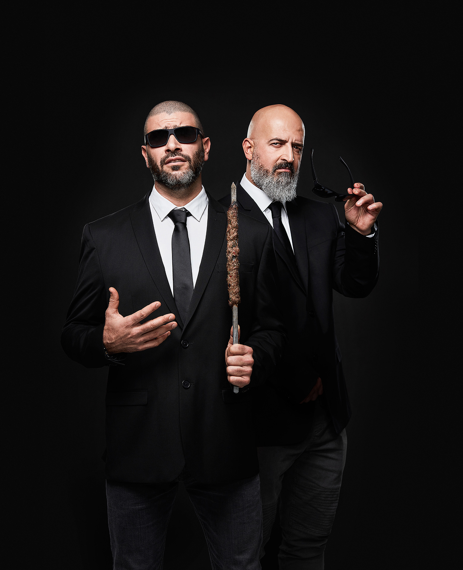 portrait of chefs Charbel Yazbeck and Akram Sleiman posing in a Men in Black Fashin wearing sunglasses looking badass by Jocelyn Michel for the Cathcart