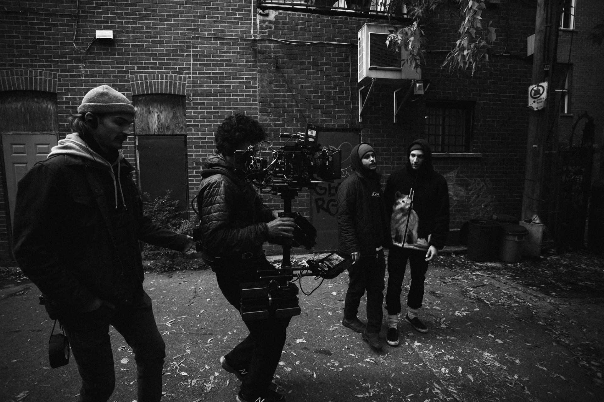 camera assistant filming by walking with camera strapped to him in behind the scenes of TV series La Loi C'est La Loi filmed by Les Gamins for TV5 Unis