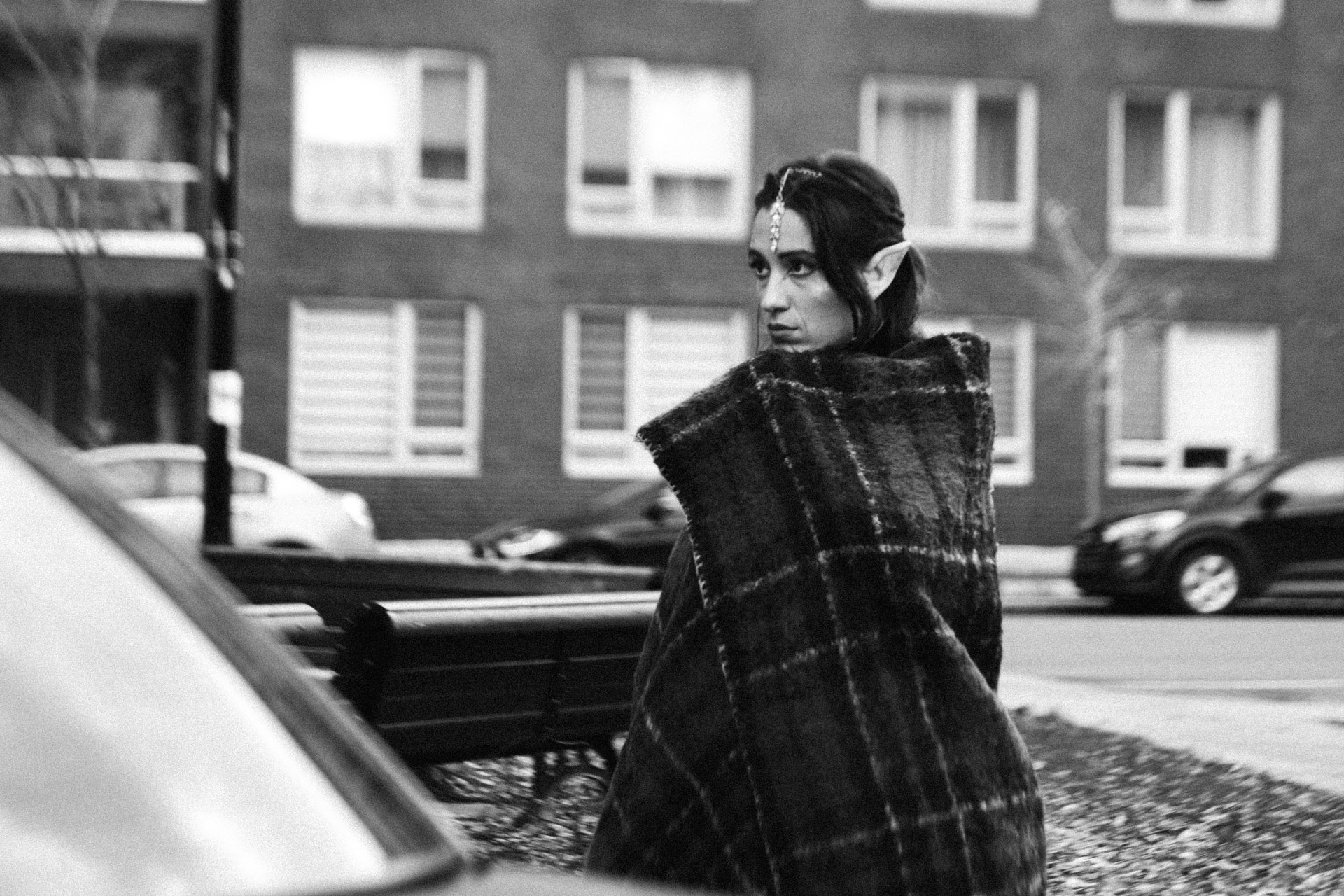 actress dressed as an elf outside keeping blanket snug around her in behind the scenes of TV series La Loi C'est La Loi filmed by Les Gamins for TV5 Unis