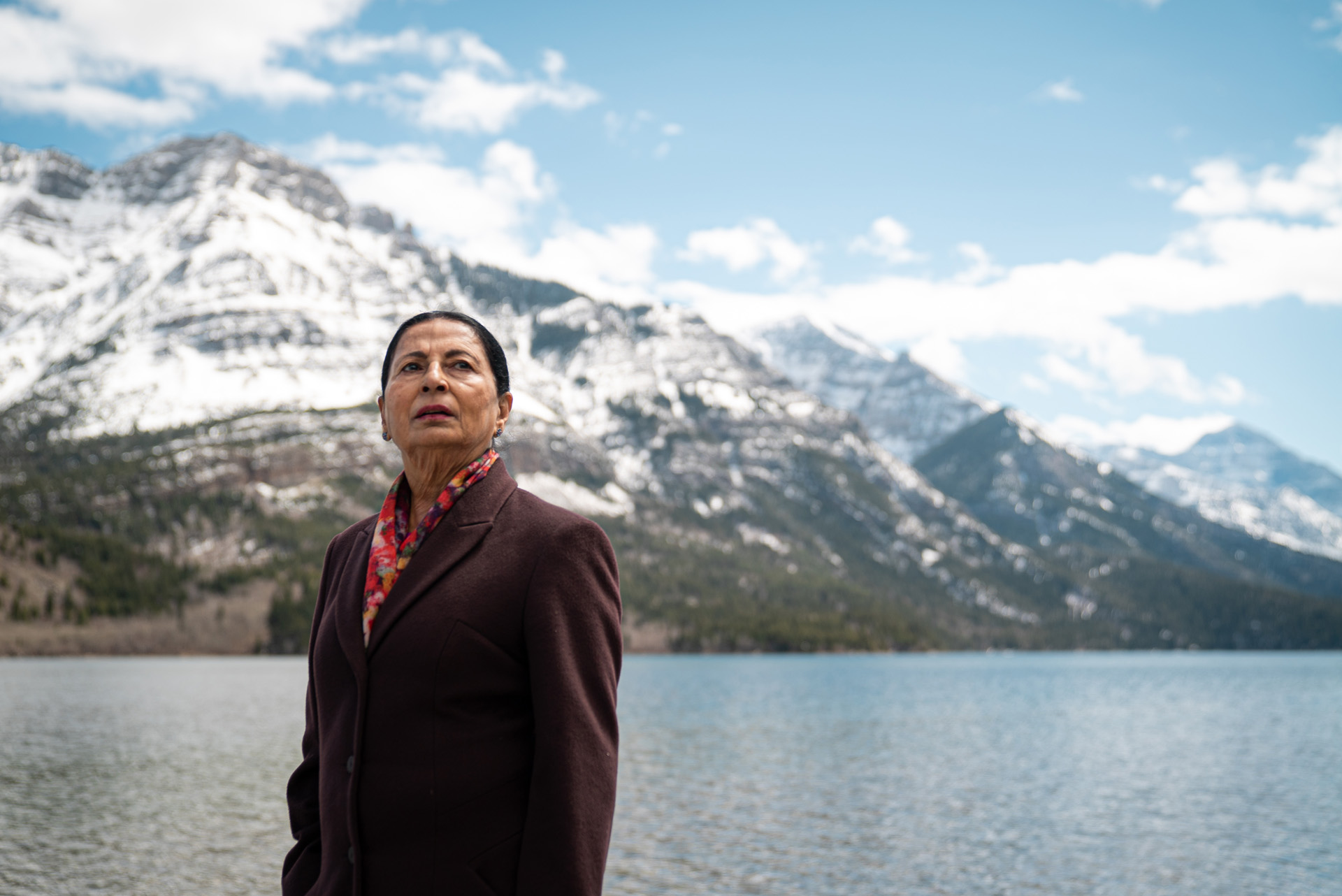 indigenous woman posing in front of snowy mountains and lake by Bruno Florin for BDC Beyond Business with Cossette