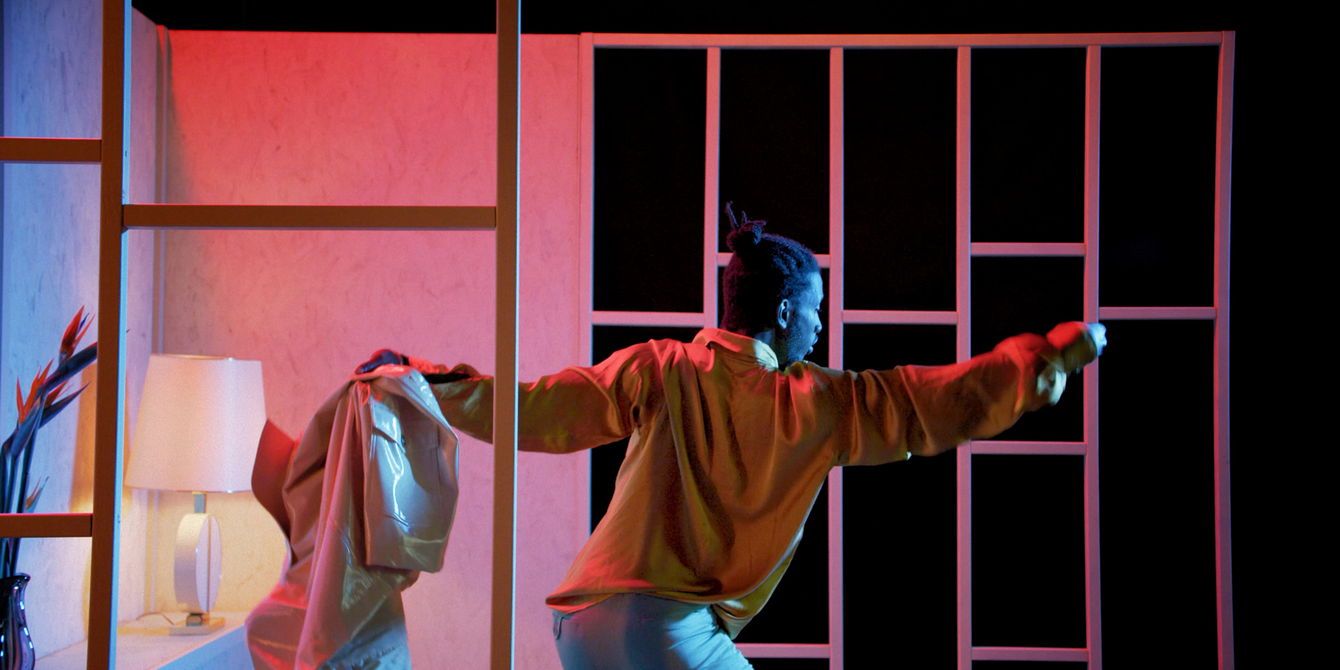 black dancer in red and blue lighting by Simon Duhamel for Dutch for Fabrikate