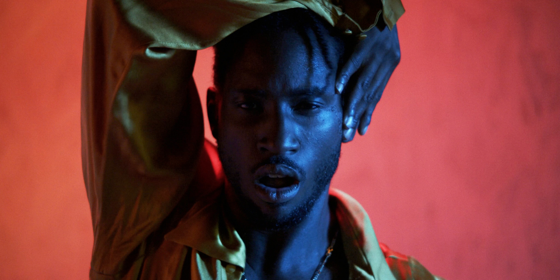 black dancer in red and blue lighting by Simon Duhamel for Dutch for Fabrikate