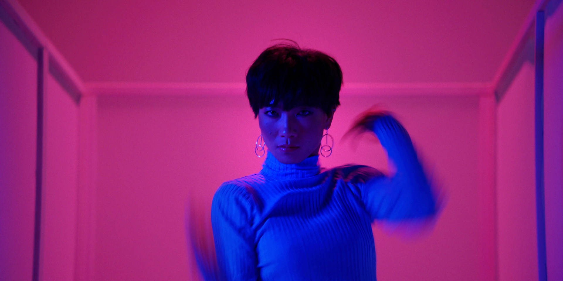 asian female dancer in pink lighting by Simon Duhamel for It's Coming Down for Fabrikate