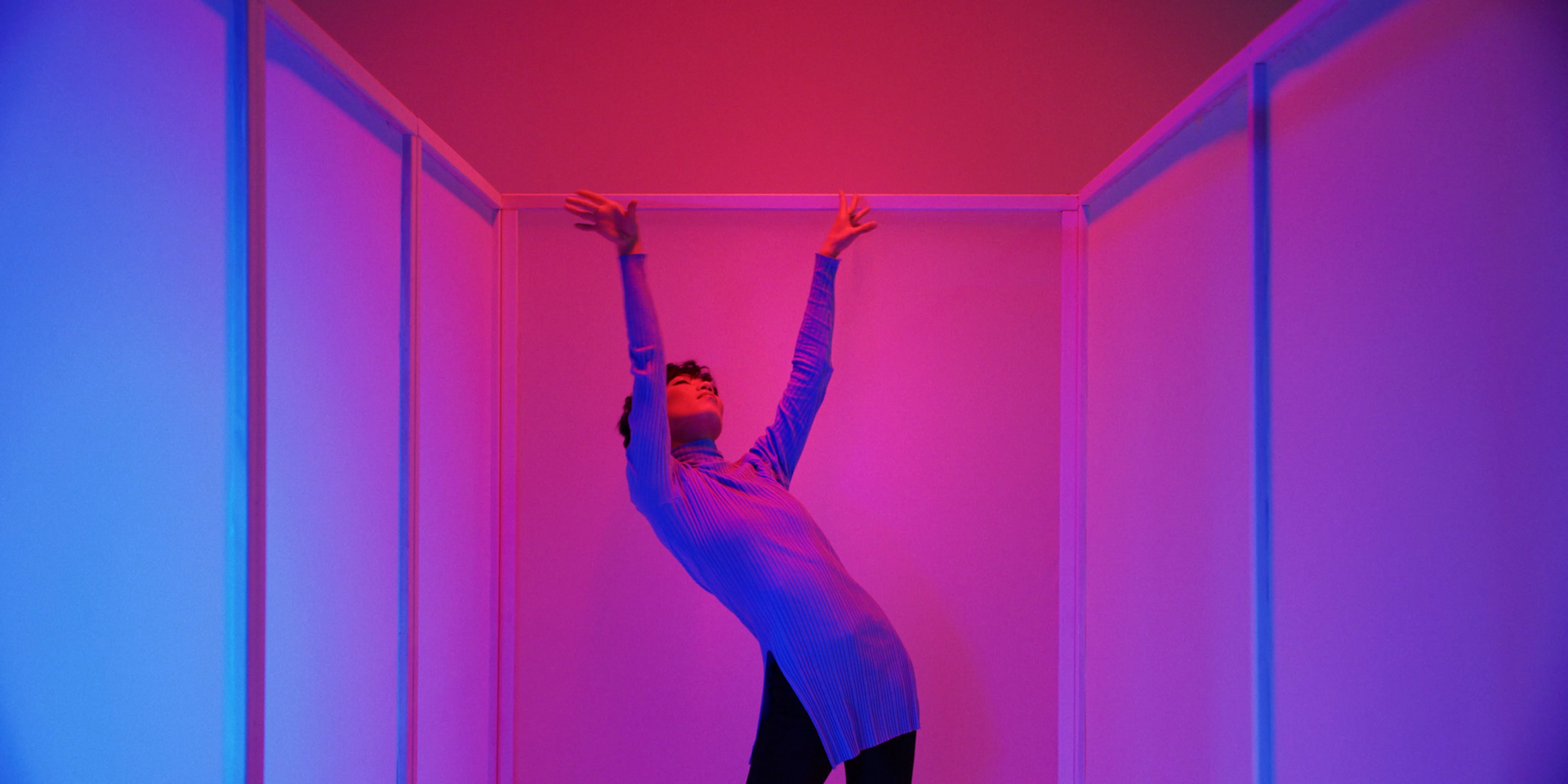 asian female dancer in pink lighting by Simon Duhamel for It's Coming Down for Fabrikate