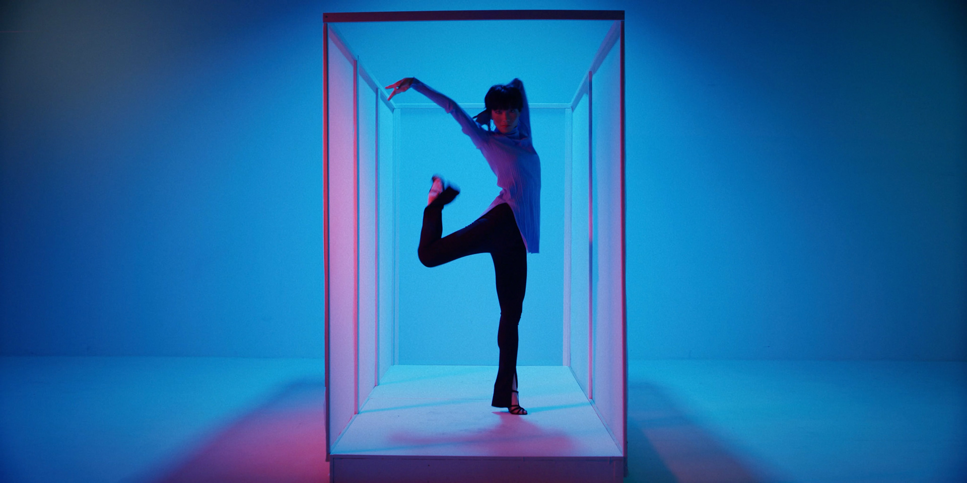 asian female dancer in pink lighting by Simon Duhamel for It's Coming Down for Fabrikate