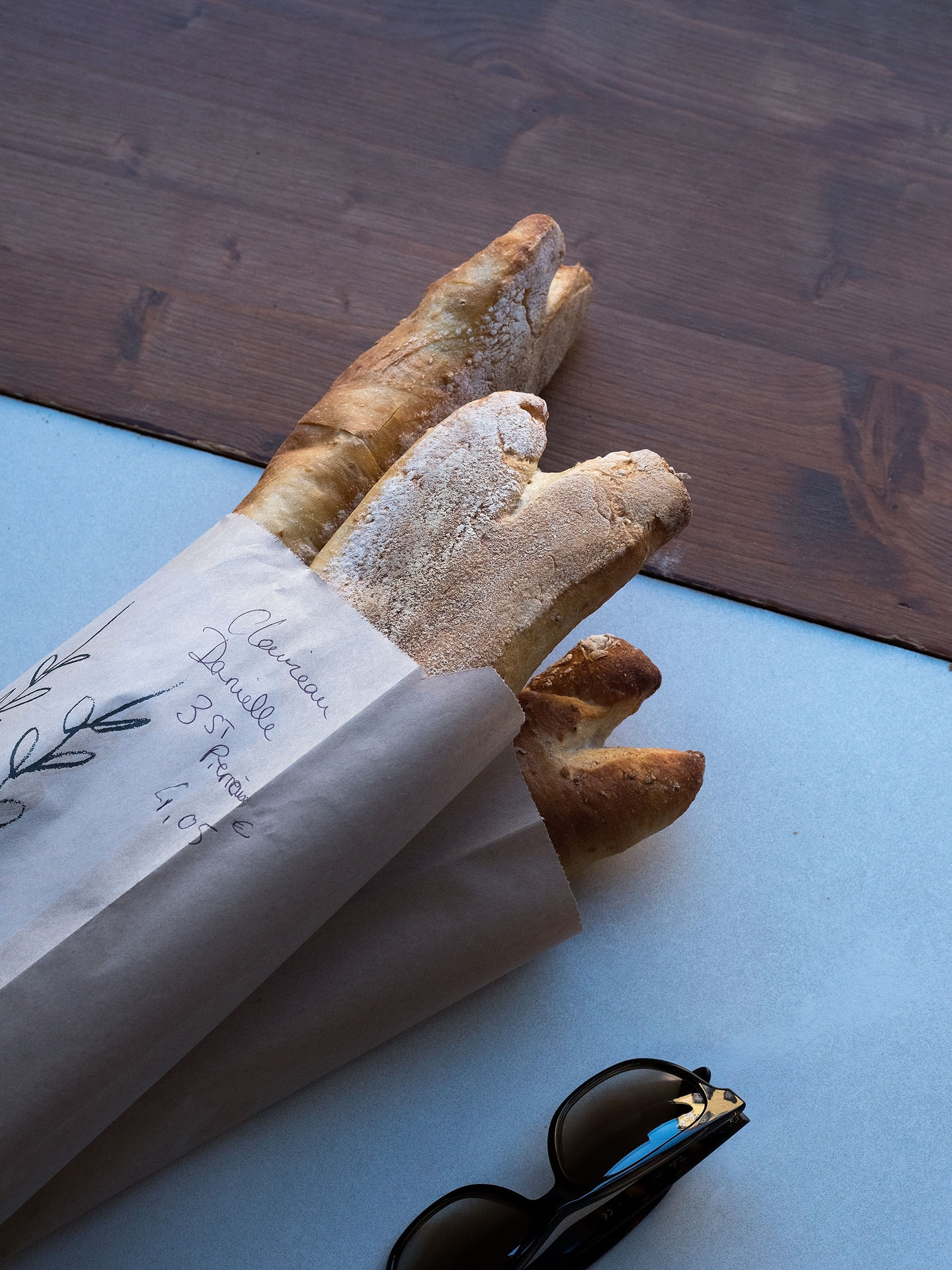 rustique french bread baguettes in brown wrapping paper by Guillaume Simoneau in Saint-Pierre-et-Miquelon for M le mag