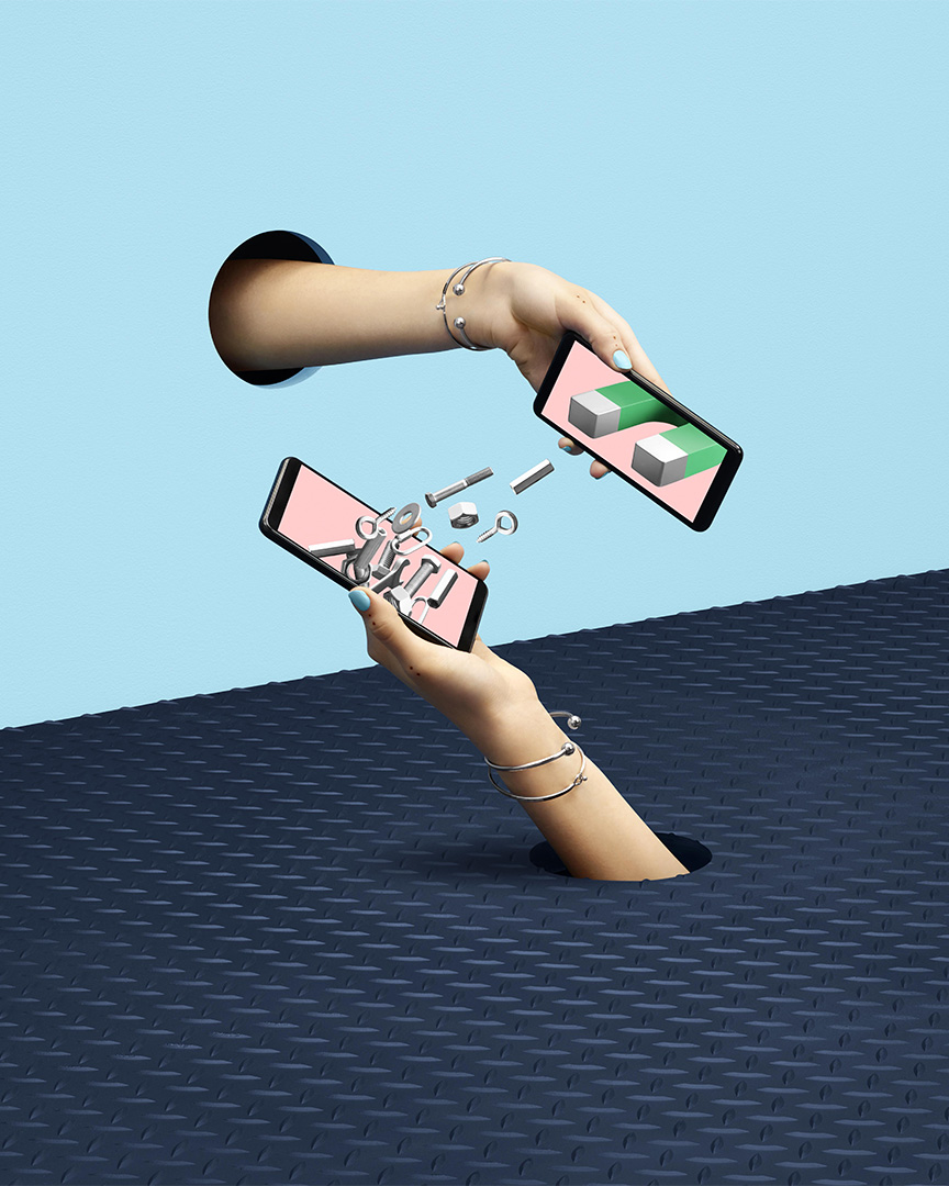 surrealist shot of magnets between two mobile phones by Simon Duhamel for Fizz