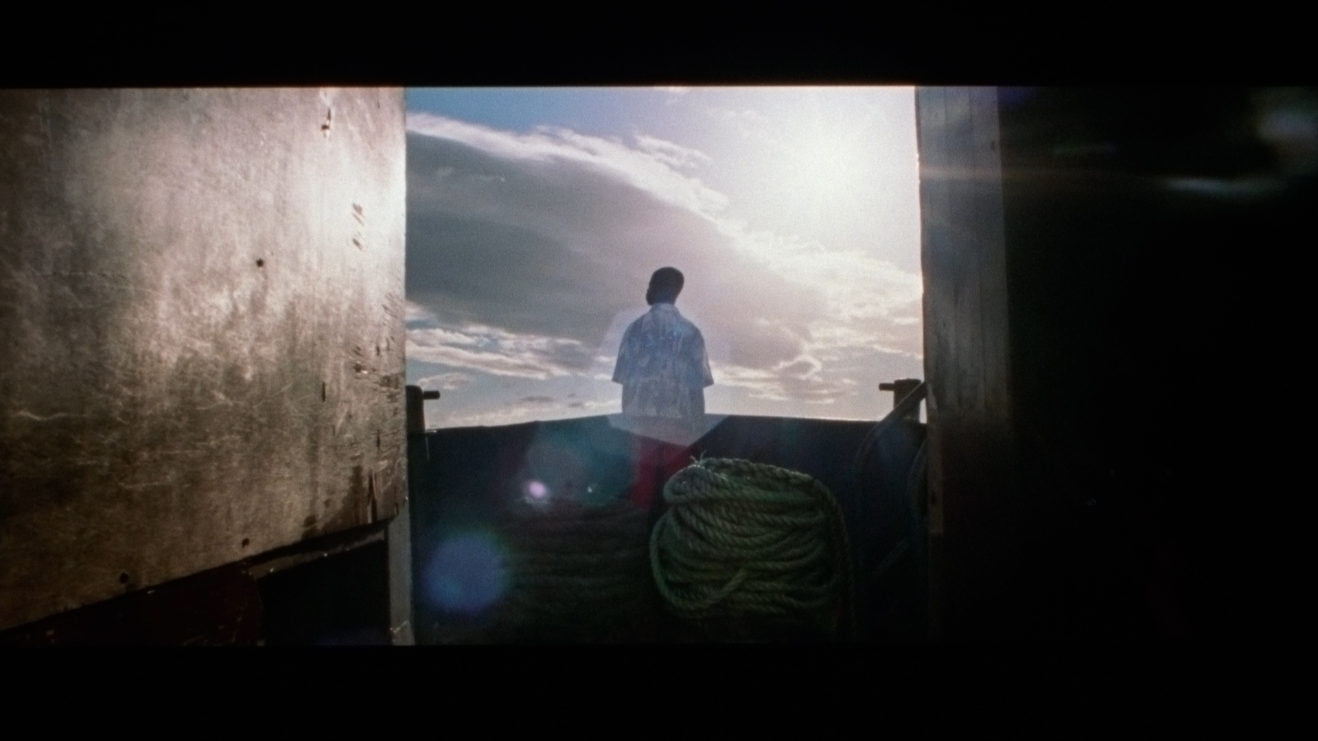 singer Karim Ouellet on a boat for his music video of La Mer A Boire filmed by Les Gamins