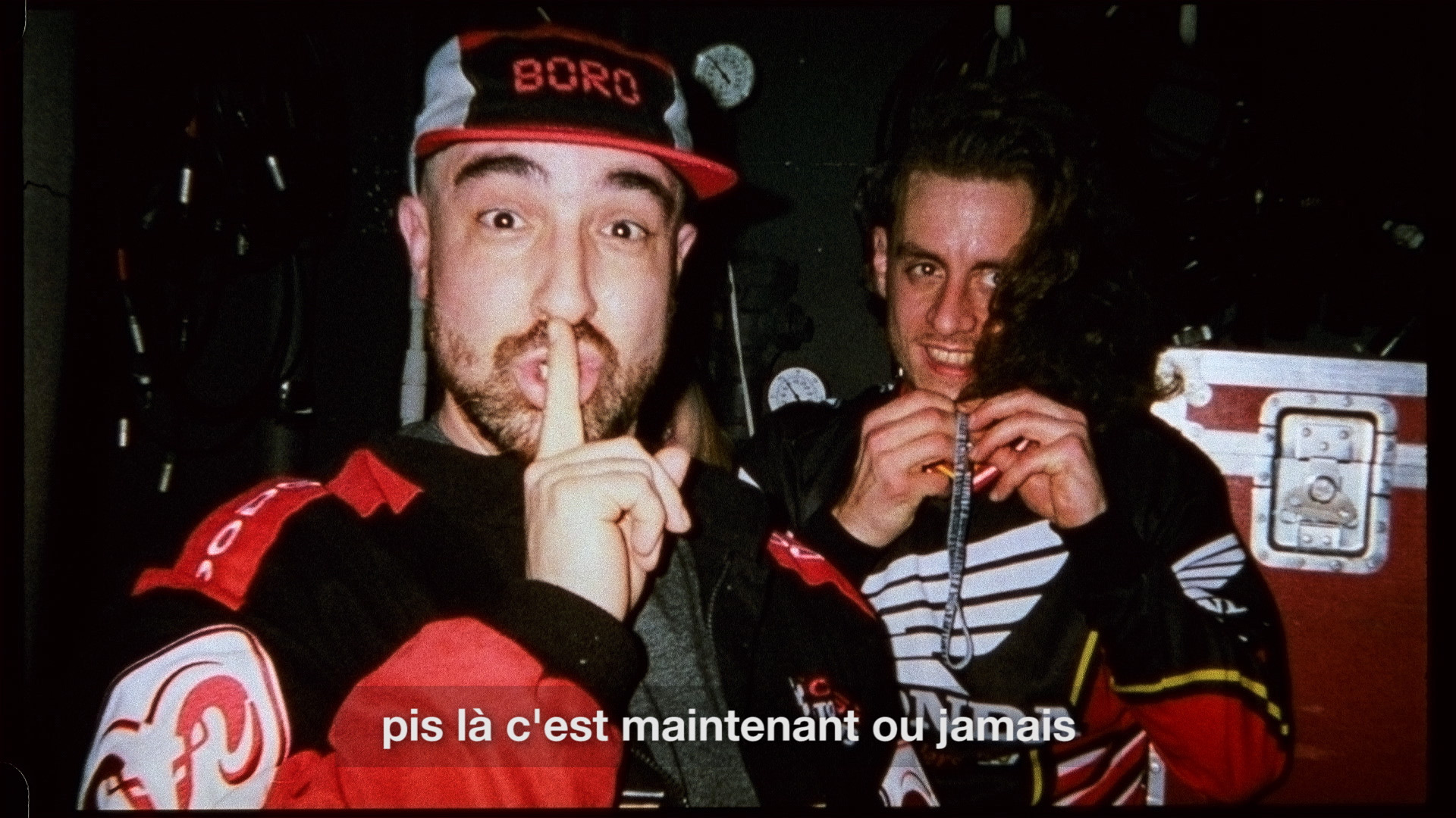 Alaclair Ensemble singer with finger in front of his mouth for L'Osstidfilm documentary filmed by Vincent Ruel-Cote from Les Gamins about L'Osstidtour