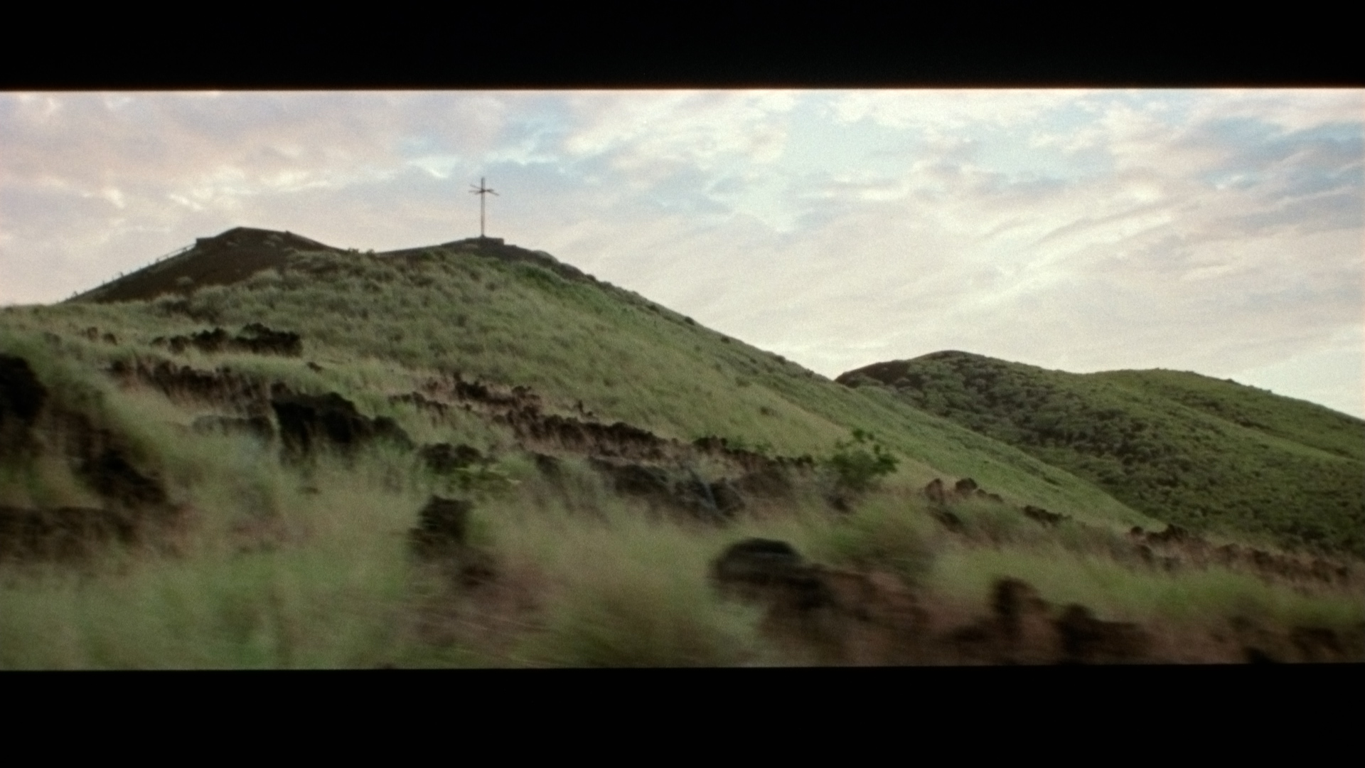 green hills seen from the road for singer Karim Ouellet music video of La Mer A Boire filmed by Les Gamins
