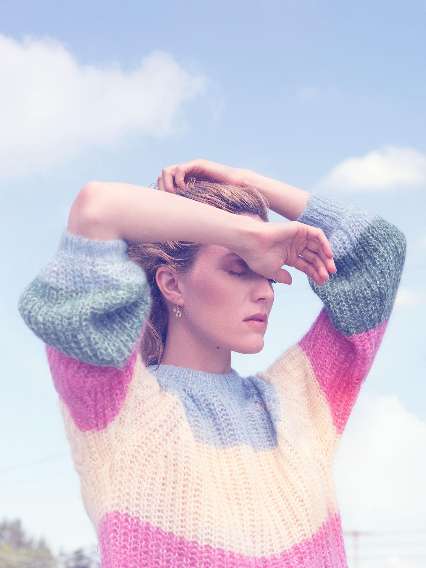 portrait of Evelyne Brochu in pastels colours eyes closed arms above her head by Jocelyn Michel for Voir